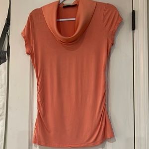The limited size small coral colored top with satin color and gathered sides.